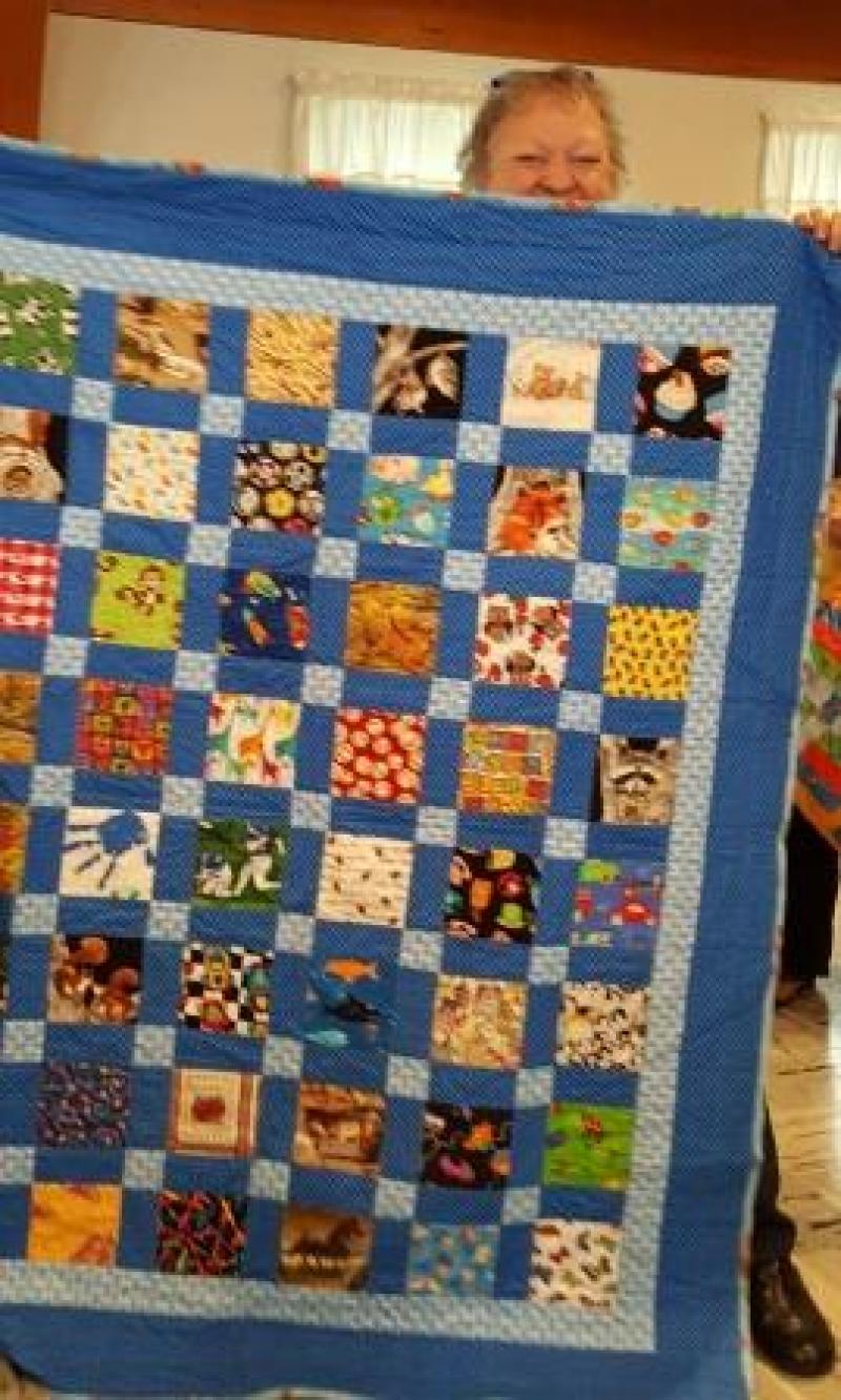 One of our newer members, Pokey D. is showing a little boys I Spy Quilt